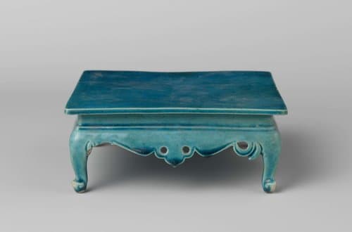 Square table on four curved legs by anonymous