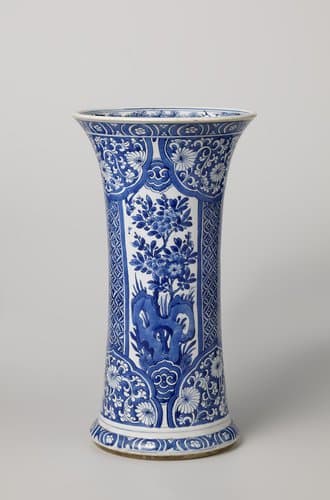 Beaker vase with flowering plants near a rock, diaper pattern and floral scrolls by anonymous