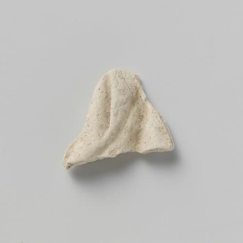 Figurine, Fragment of the Garment by anonymous; anonymous