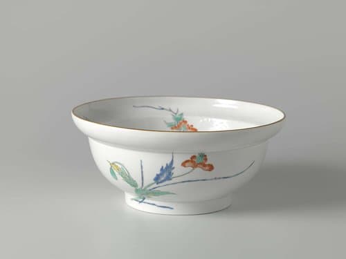 Bowl with shishi and flower sprays in relief and enamels by anonymous