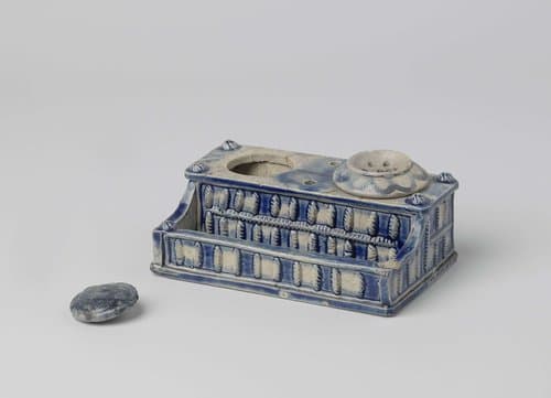 Ink stand with a relief decoration by anonymous