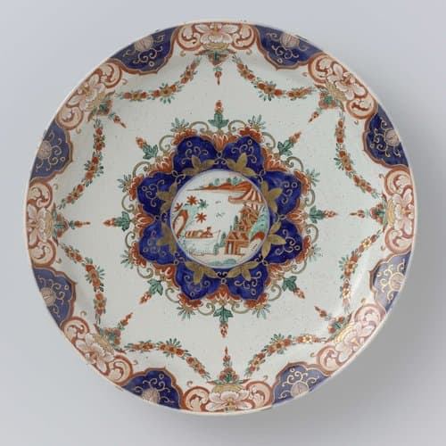 Bord van veelkleurig beschilderde faïence by anonymous