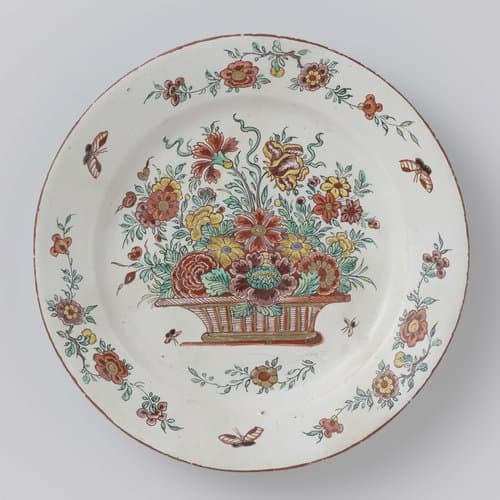 Bord van faïence met bloemenmand by anonymous