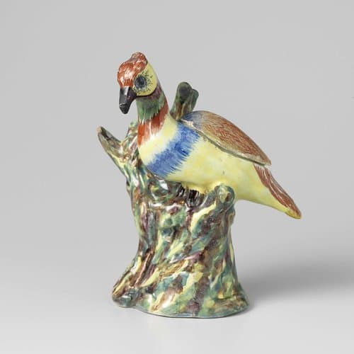 Vogel op boomstam van faience by anonymous