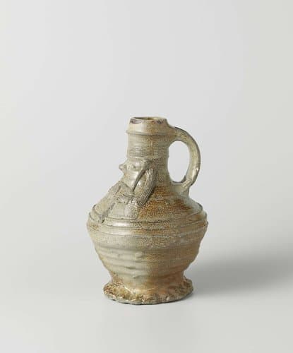 Jug with a face and a bagpipe player by anonymous