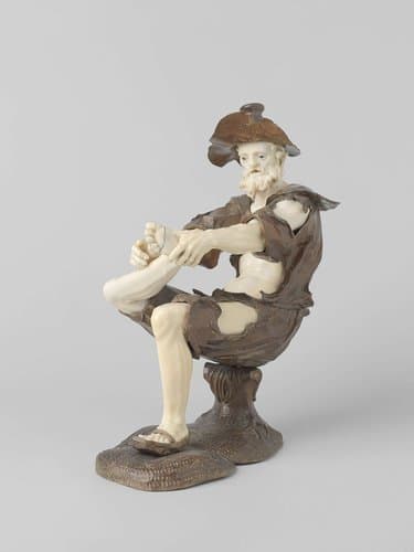 Zittend bedelende figuur by Simon Troger