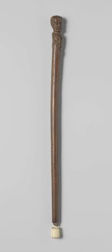 Wandelstok van hout met saterkop op knop by anonymous