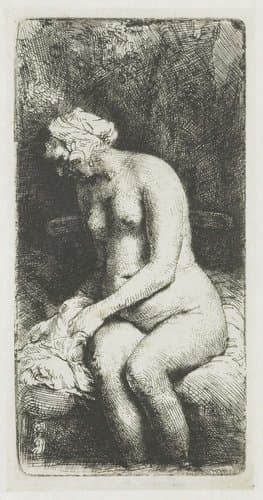 Woman bathing her feet at a brook by Rembrandt van Rijn