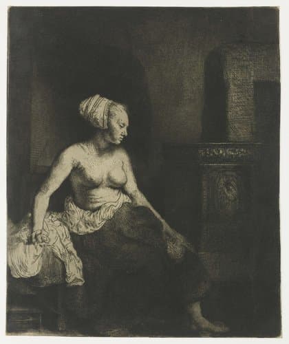 Woman sitting half dressed beside a stove by Rembrandt van Rijn