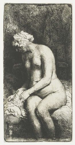 Woman bathing her feet at a brook by Rembrandt van Rijn