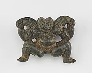 A crouching figure by Unknown