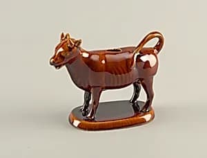 Creamer and cover by Unknown