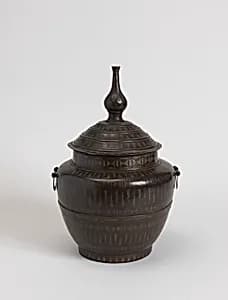 Jar and cover by Unknown
