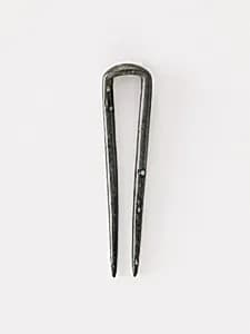 Topknot pin by Unknown