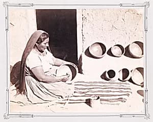 Woman Polishing Pottery