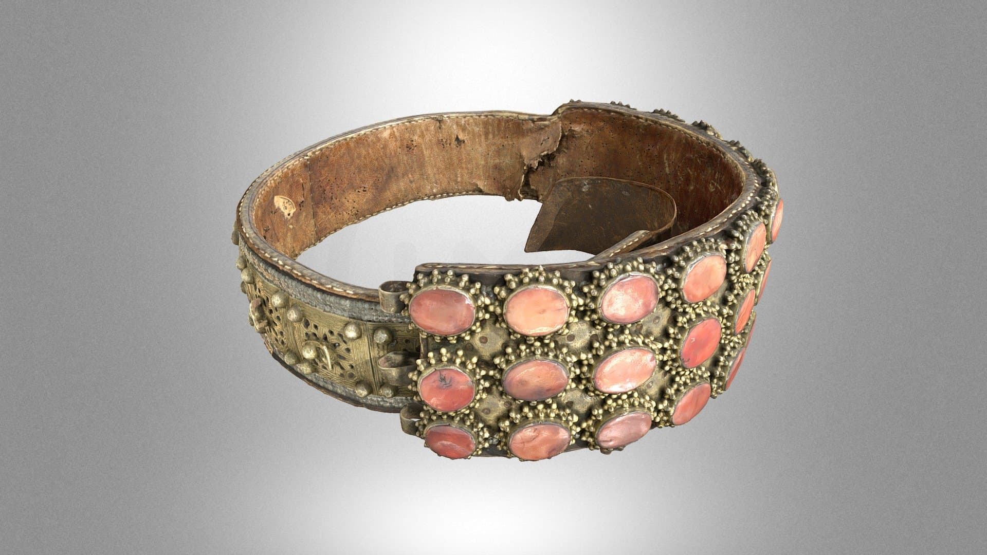 A leather belt decorated with metal ornaments
