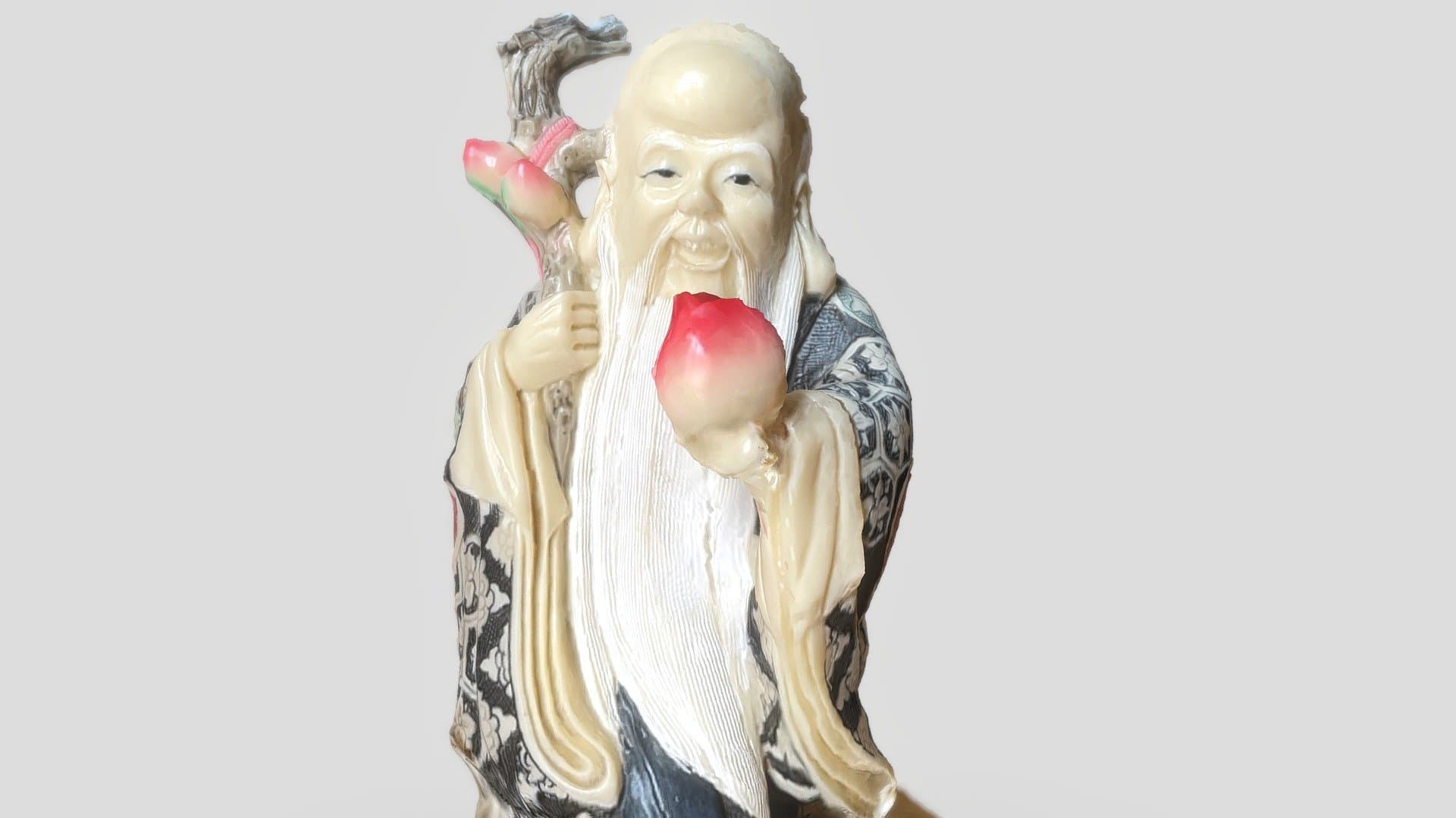 Chinese wise man offering a peach